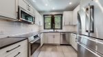 fully equipped with stainless steel appliances and granite counter tops